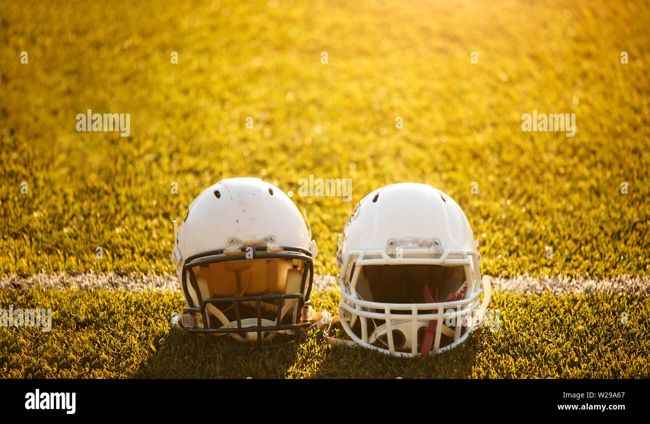 Image of two football helmets on stadium Stock Photo Alamy