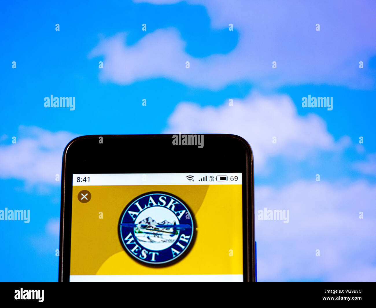 In this photo illustration the Alaska West Air Inc logo is seen