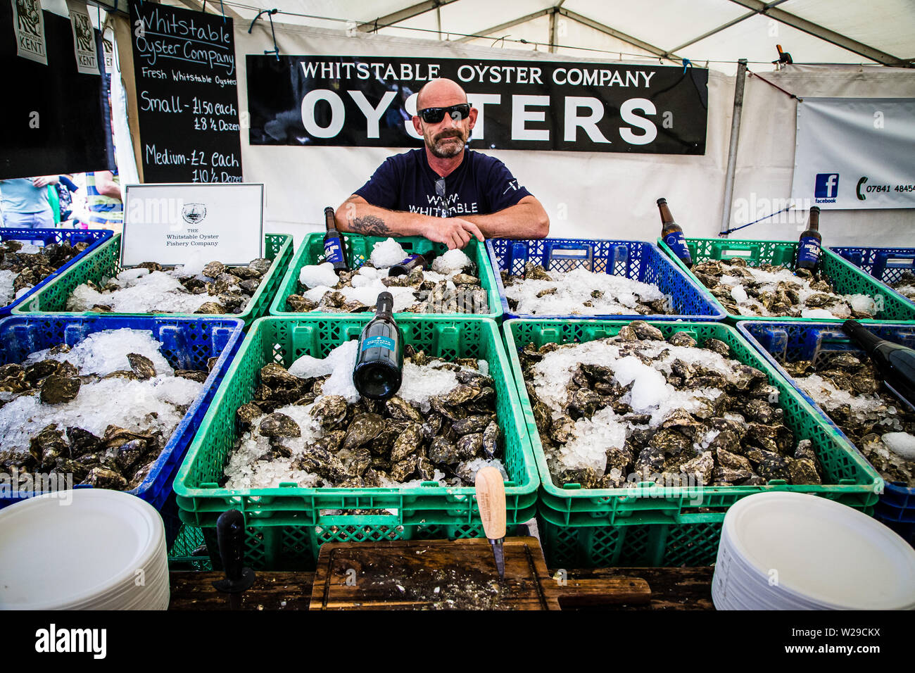 90th Kent County Show, Detling, 6th July 2019. The manager from The Whitstable Oyster Fishery Company displays his produce. Stock Photo