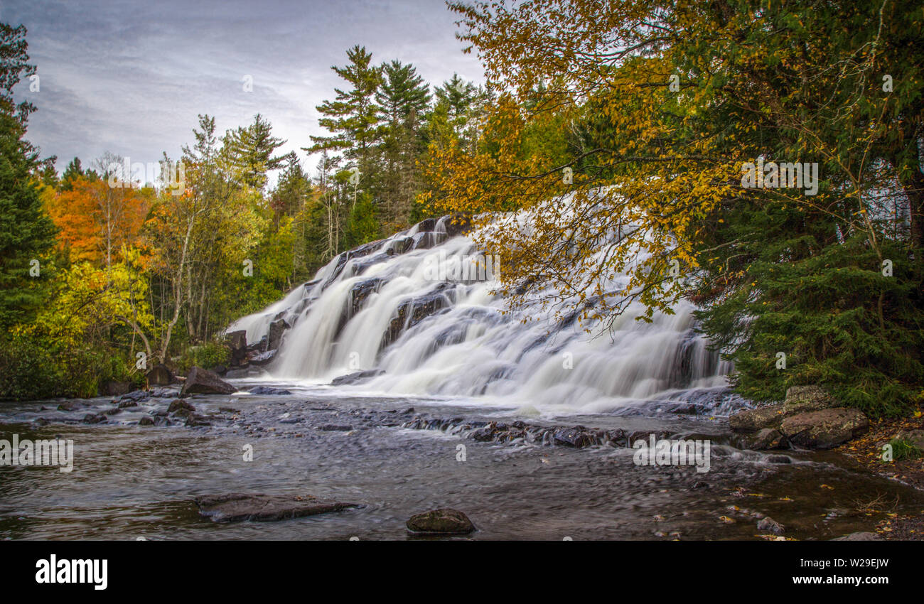 Michigan Fall Colors. Panorama of beautiful Bond Falls in the Upper Peninsula of Michigan surrounded by fall foliage Stock Photo
