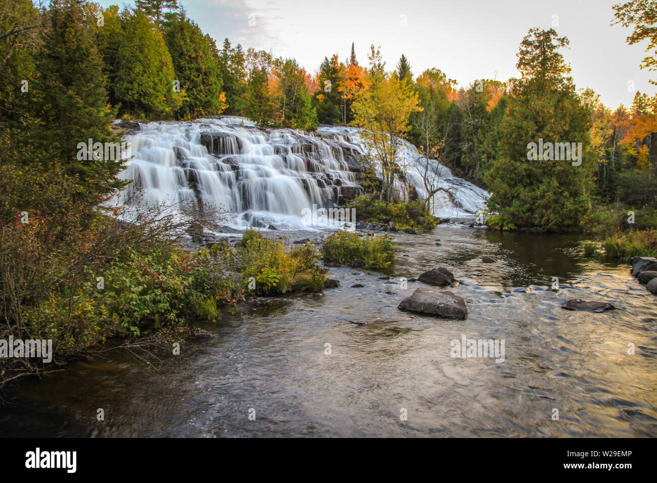Michigan Fall Colors. Panorama of beautiful Bond Falls in the Upper Peninsula of Michigan surrounded by fall foliage Stock Photo