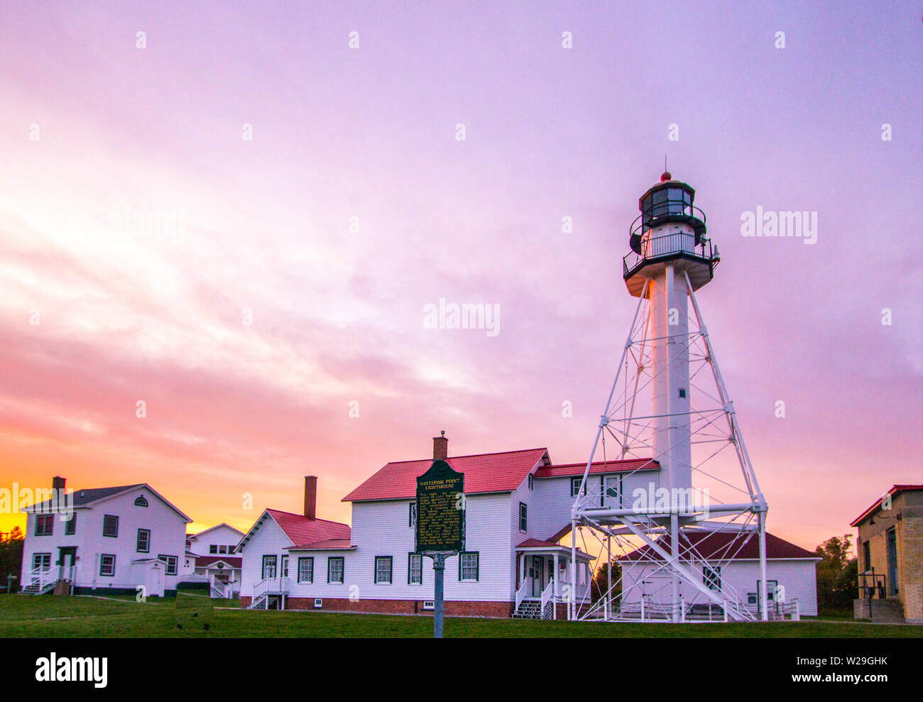 Lighthouse Sunset. Beautiful sunset at the Whitefish Point Lighthouse on the coast of Lake Superior in the Upper Peninsula of Michigan Stock Photo