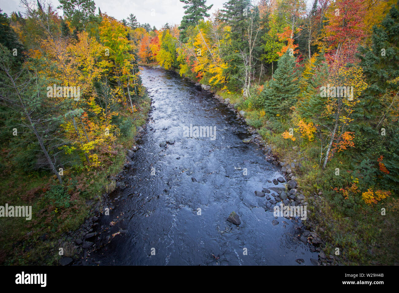 Michigan Autumn River Landscape. River in Upper Peninsula shot from above. Stock Photo