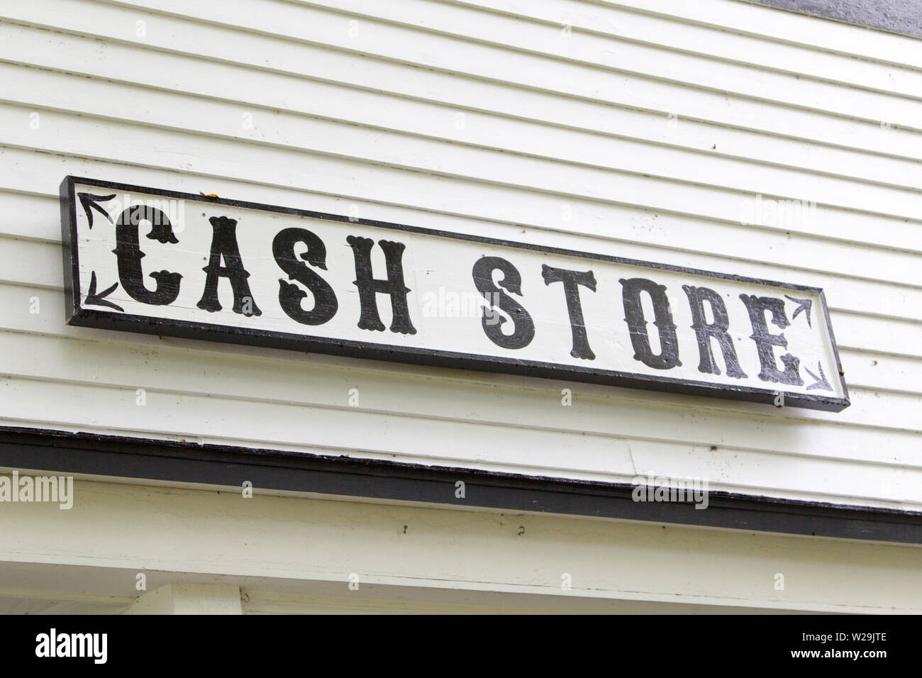 Cash Store Sign. Historical general store that accepts only cash payment. Stock Photo