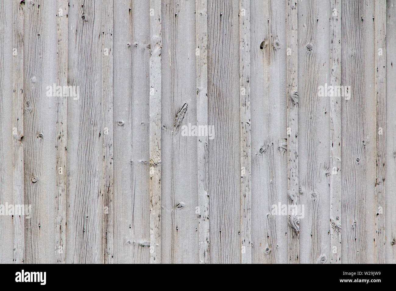 Textured Grain Barn Wood Background. Grey weathered wooden barn wall background in horizontal orientation. Stock Photo