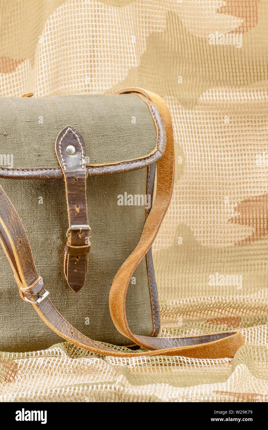 Old vintage canvas bag with leather strap Stock Photo