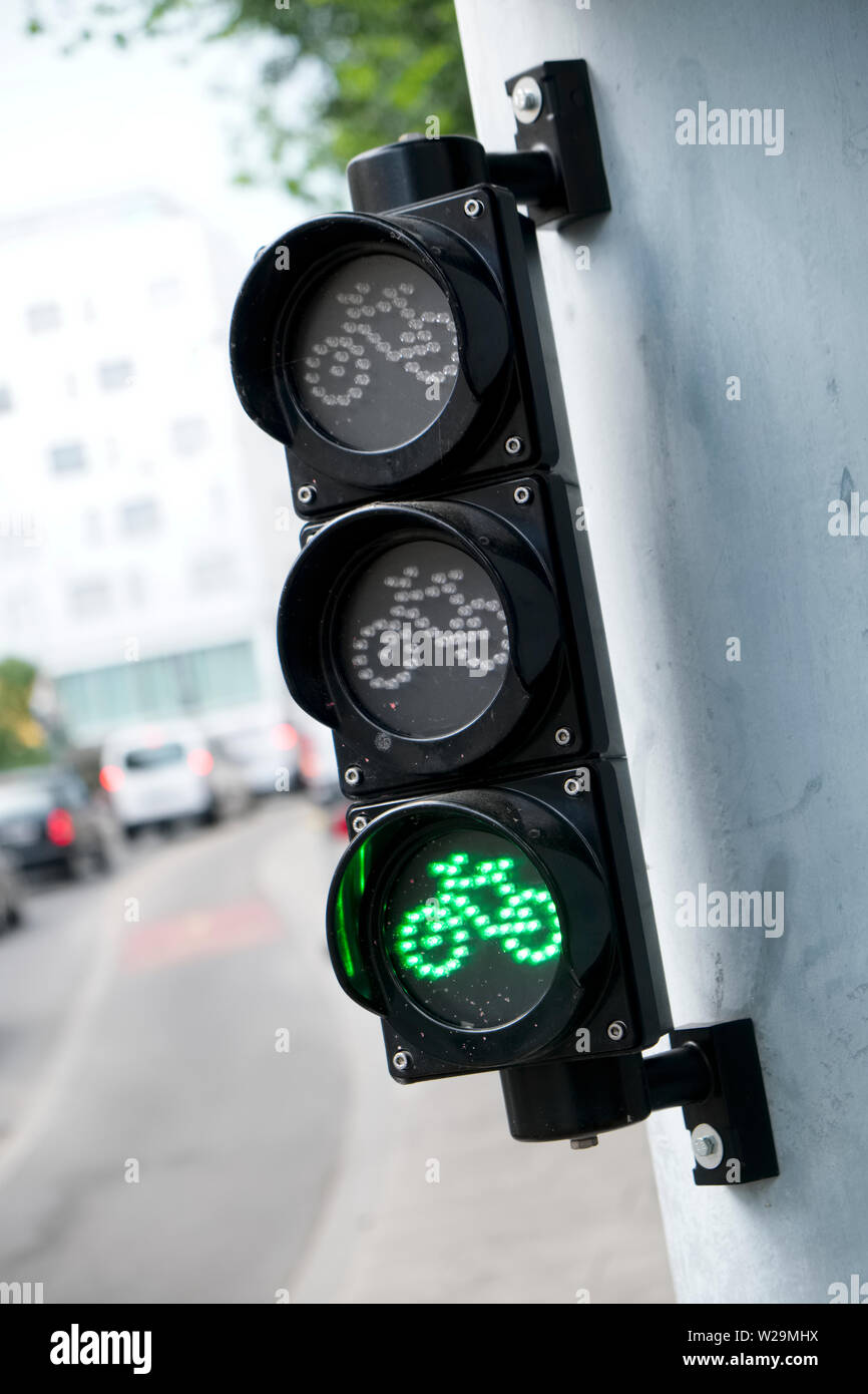 A green light at traffic lights on a cycle lane Geneva Switzerland Stock Photo