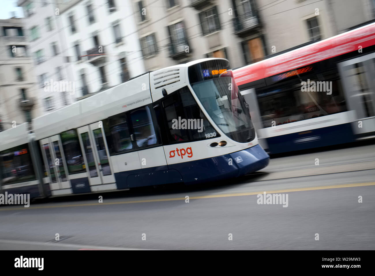 A TPG tram in motion in the Servette area of Geneva Switzerland Stock Photo