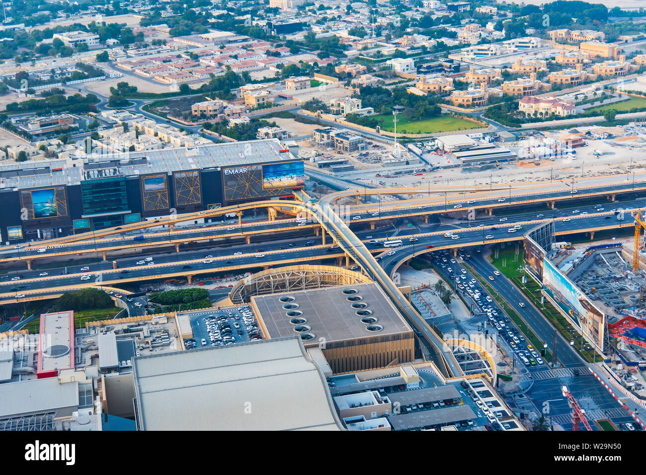 Dubai, United Arab Emirates - July 5, 2019: Roads and streets of Dubai downtown leading to Dubai mall parking top view Stock Photo