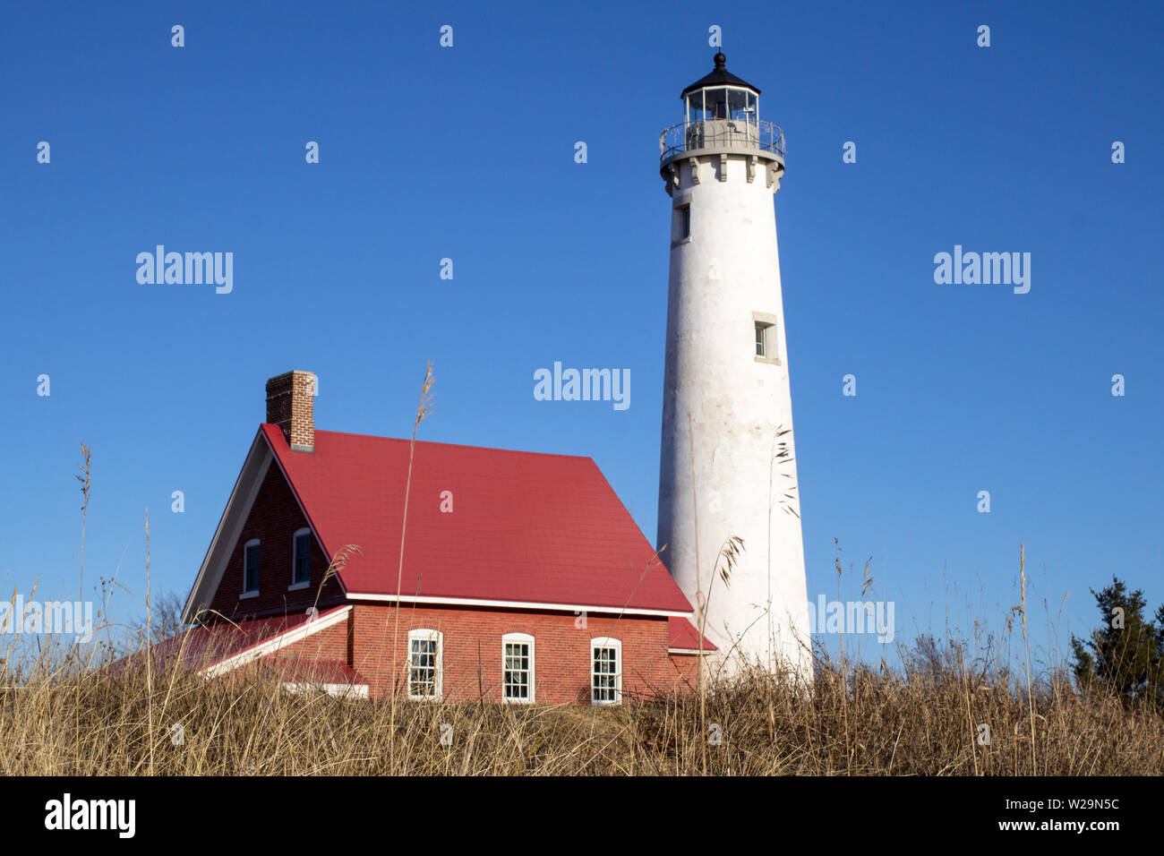 Great Lakes Lighthouse. The Tawas Point Lighthouse has stood on the shores of Lake Huron for over a century. Tawas State Park. Tawas City, Michigan. Stock Photo