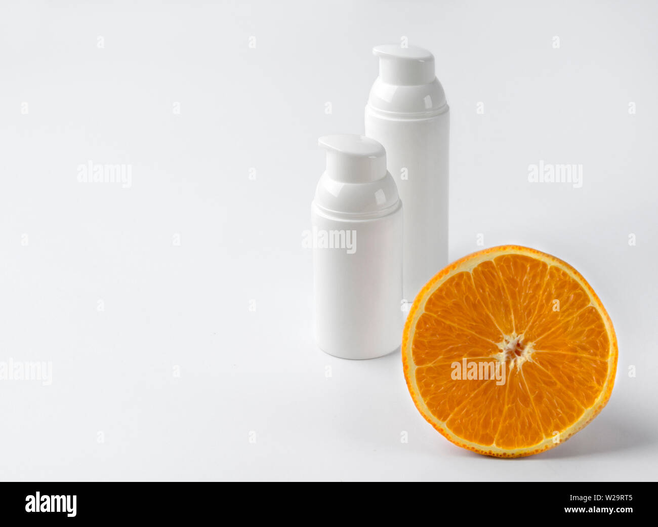 Download Two Bottles Of Cosmetic Cream With Orange On White Background Blank Label For Branding Mockup Beauty And Skin Care Concept Stock Photo Alamy Yellowimages Mockups