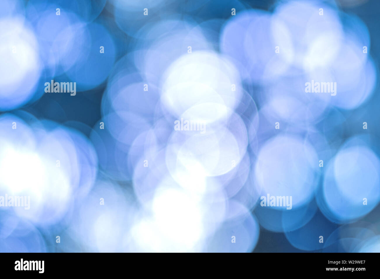 Abstract image. Blurry lights on blue background. Stock Photo
