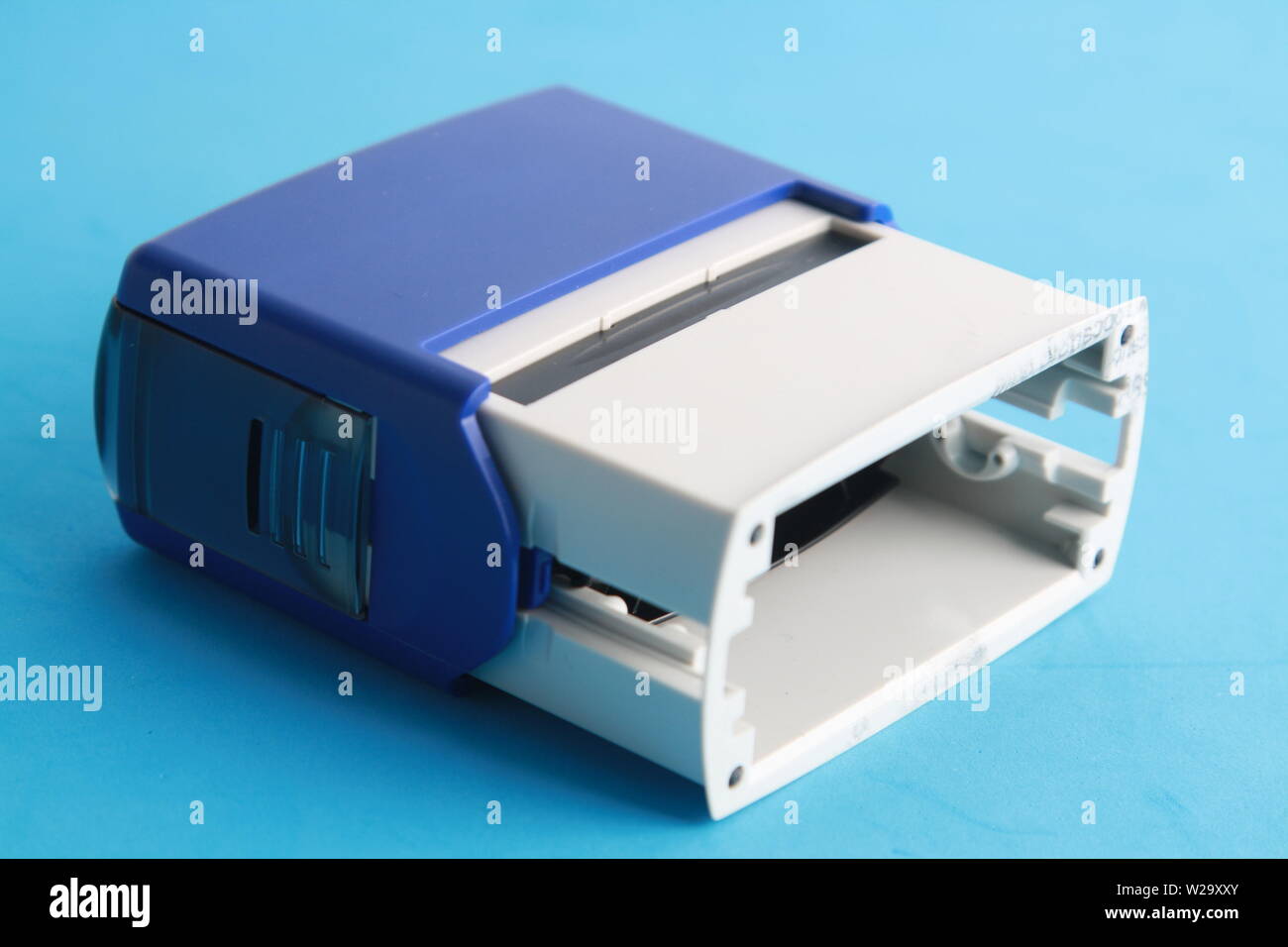 Automatic ink stamp manufactured in blue plastic Stock Photo Alamy