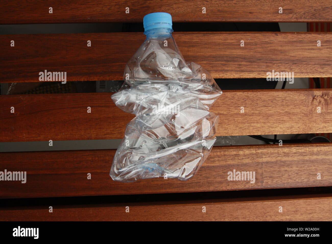Empty plastic water bottle scaled for recycling Stock Photo