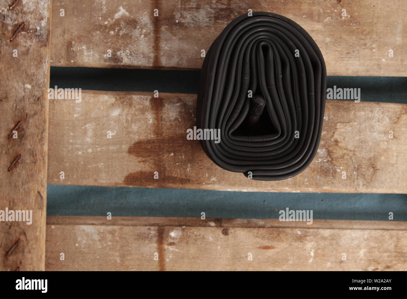 bicycle wheel camera on wooden background Stock Photo