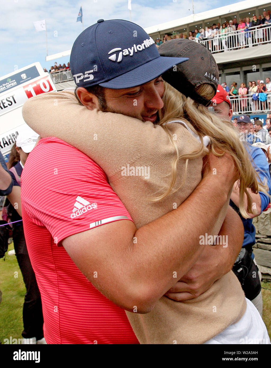 Spain's Jon Rahm with his girlfirnd Kelley Cahill at the end of his round during day four of the 2019 Dubai Duty Free Irish Open at Lahinch Golf Club. Stock Photo