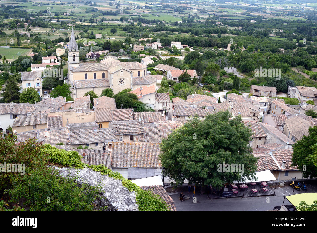 Aerial View or High Angle View over the Rooftops of the Hill Village or Perched Village of Bonnieux in the Luberon Regional Park Vaucluse Provence Stock Photo