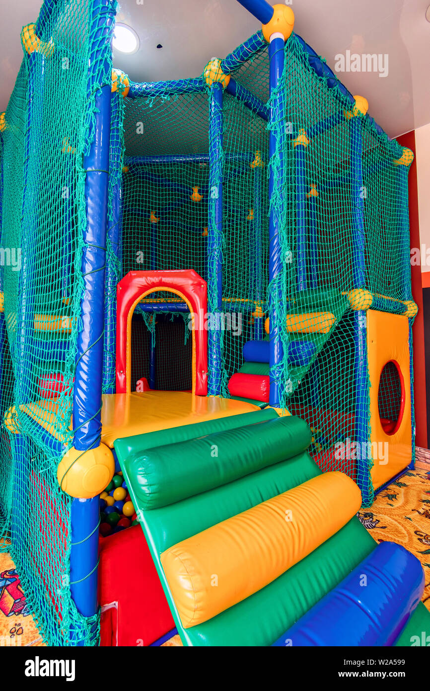 Colored game room with plastic balls in pool . Swimming pool for fun