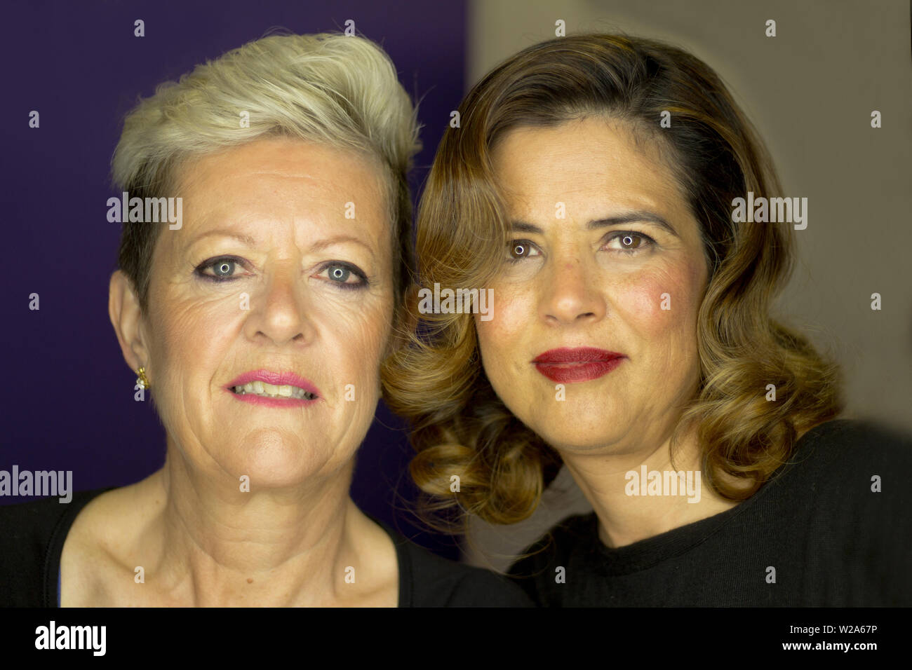 Woman With Platinum Blonde Short Hair And Woman With Wavy Brown
