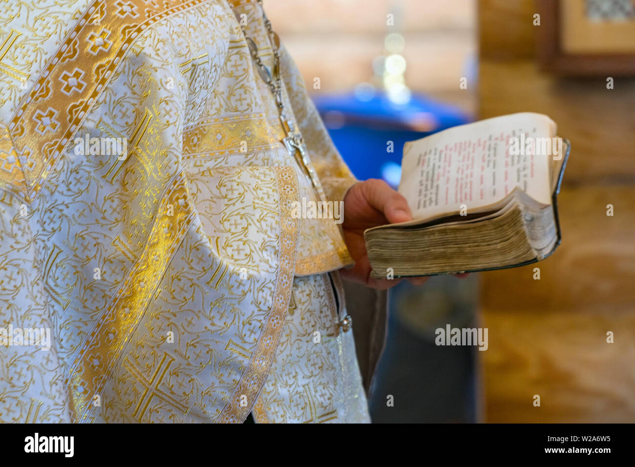 Book is in the hands of a priest Stock Photo - Alamy