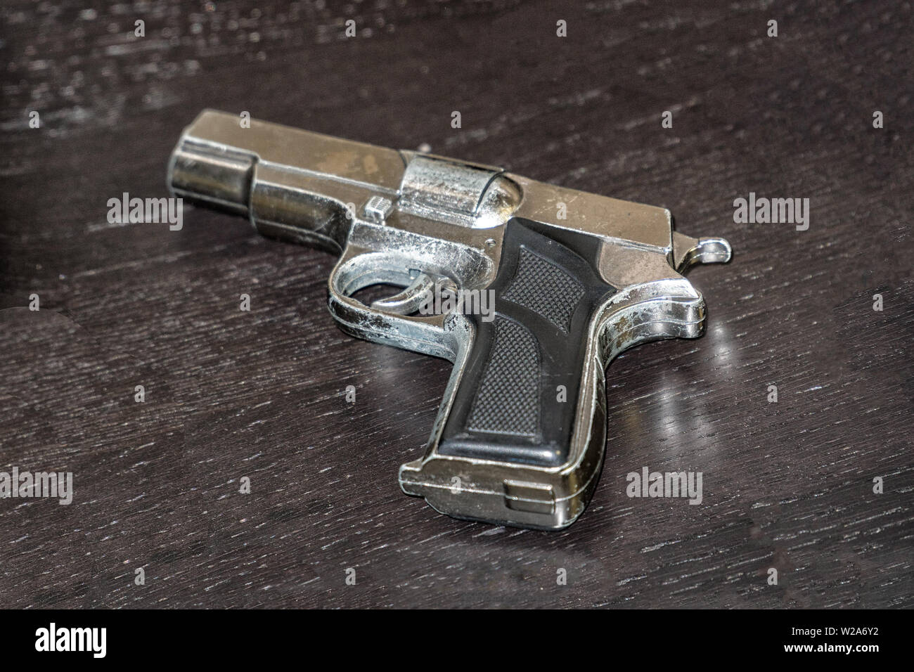 Fake gun on the table Stock Photo
