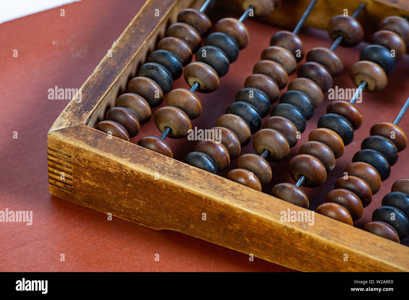 Vintage wooden abacus close up. Fragment of old abacus close up. Stock Photo