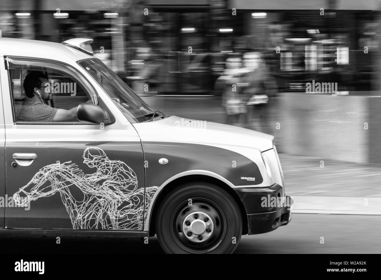 passing London cab on the street Stock Photo