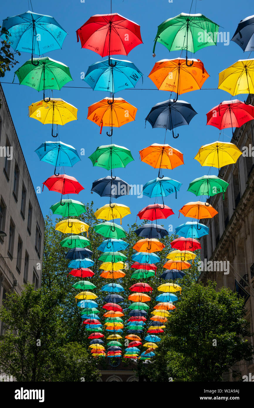 Brightly coloured umbrella hi-res stock photography and images - Alamy