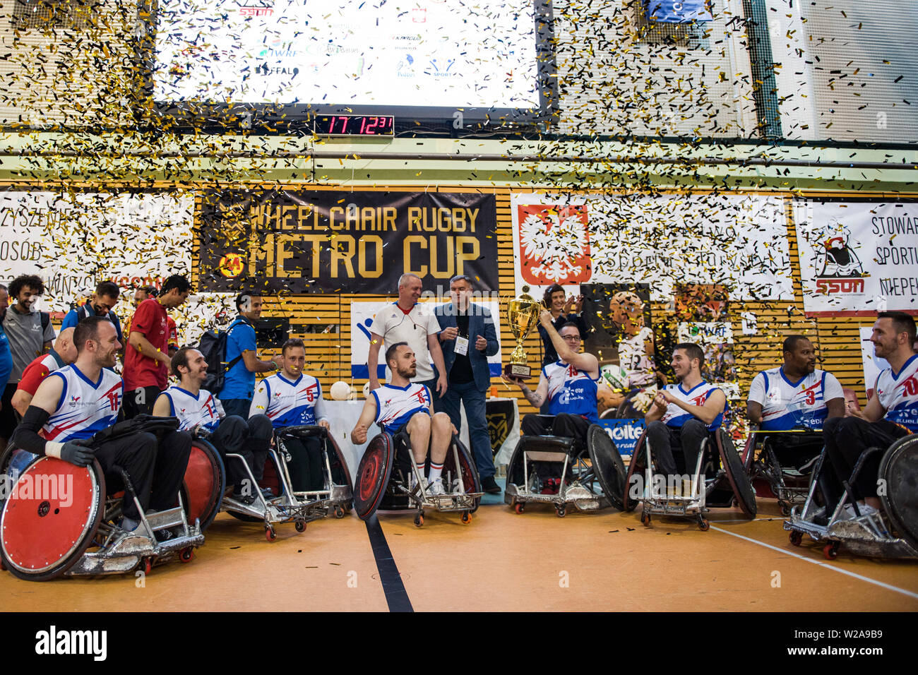 The French team celebrate their victory.The French National Team beat the Germans, 42:47 during the final and won the Metro Cup for the second time. The Metro Cup is the largest international Wheelchair Rugby Tournament in Poland. On 4-6 July 2019, the seventh edition of this event was held at the Ursynów Arena in Warsaw. Wheelchair rugby is a Paralympic sports discipline for people with spinal cord injury in the cervical segment and people with leg disorders. Stock Photo