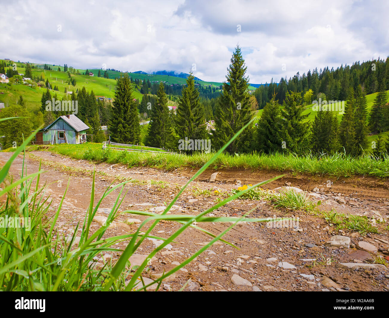 Scenic View Of A Cuontry Road Leading To An Old Village Of Wooden