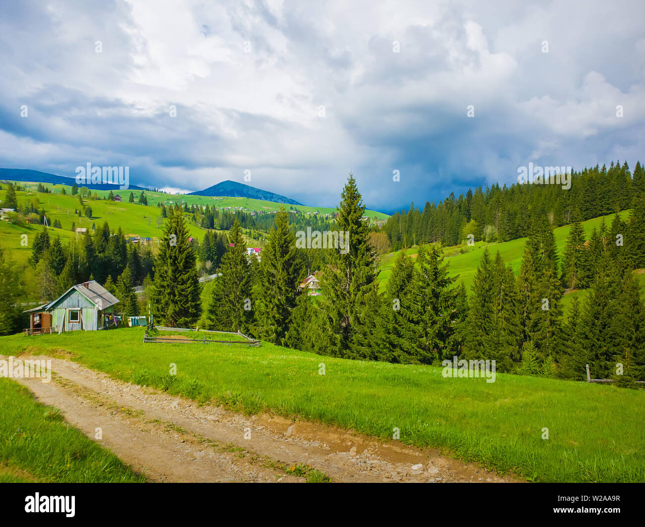 Scenic View Of A Cuontry Road Leading To An Old Village Of Wooden