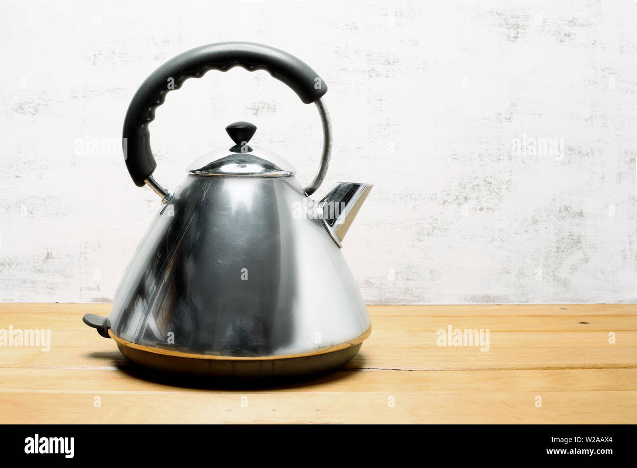 Retro Electric Kettle on Wooden Background Stock Photo