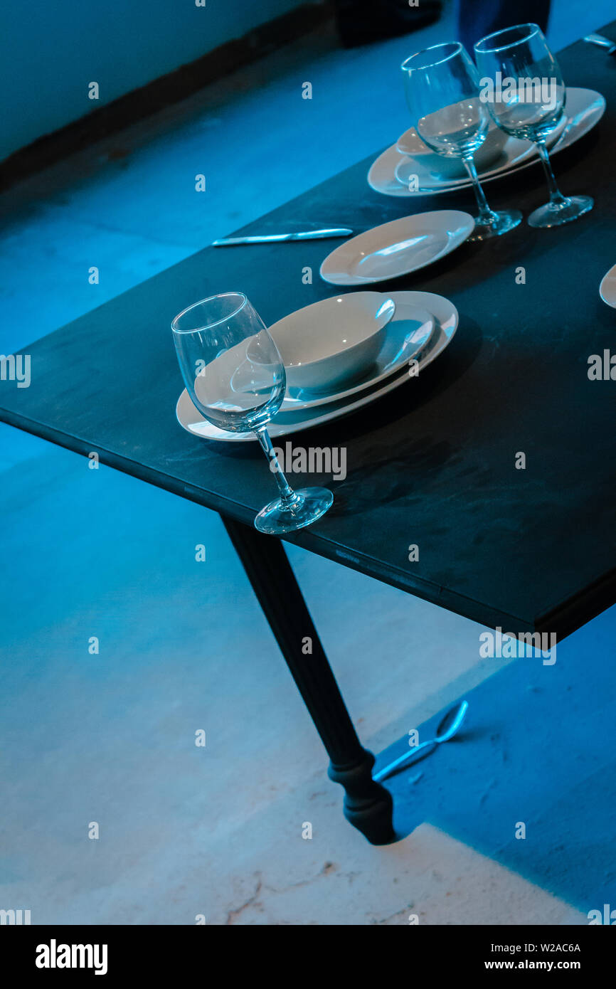 Dishes at the edge of a table Stock Photo