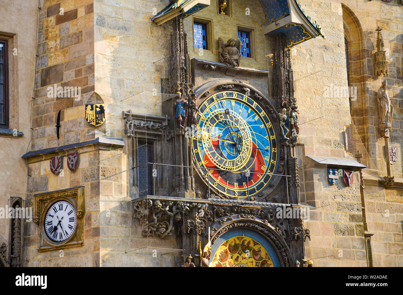 Astronomical clock in Prague, Czech Republic. Famous Orloj on the Old Town Square of the Czech capital. Photographed during morning golden hour. Detail, close up. Beautiful architecture. Stock Photo