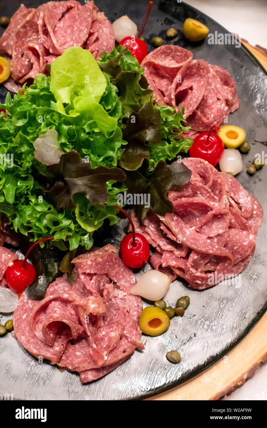 Variety of Cold cut, pork and beef salami, for salad station in buffet