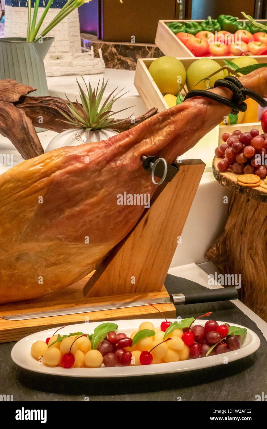 Parma Ham leg cold cut with variety of fruit Stock Photo Alamy