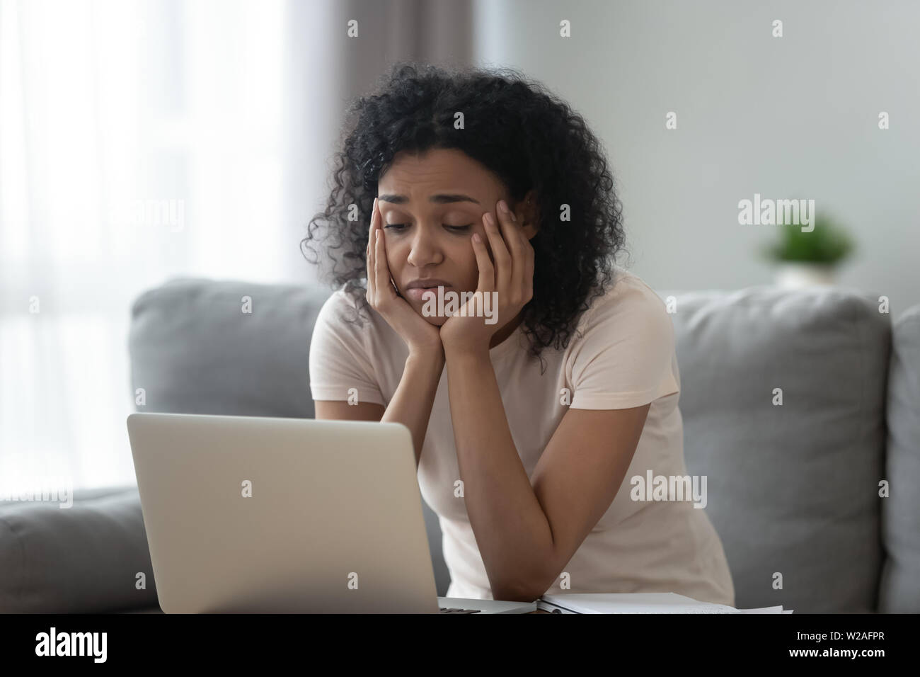 Tired bored african american woman hi-res stock photography and images ...
