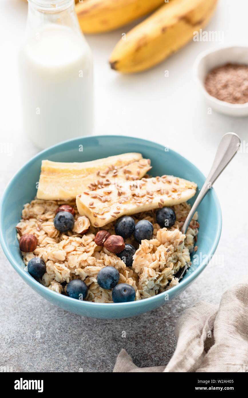 Breakfast Porridge Oats Bowl With Fruits, Flax Seeds, Nuts. Closeup View. Healthy Eating And Lifestyle Concept Stock Photo