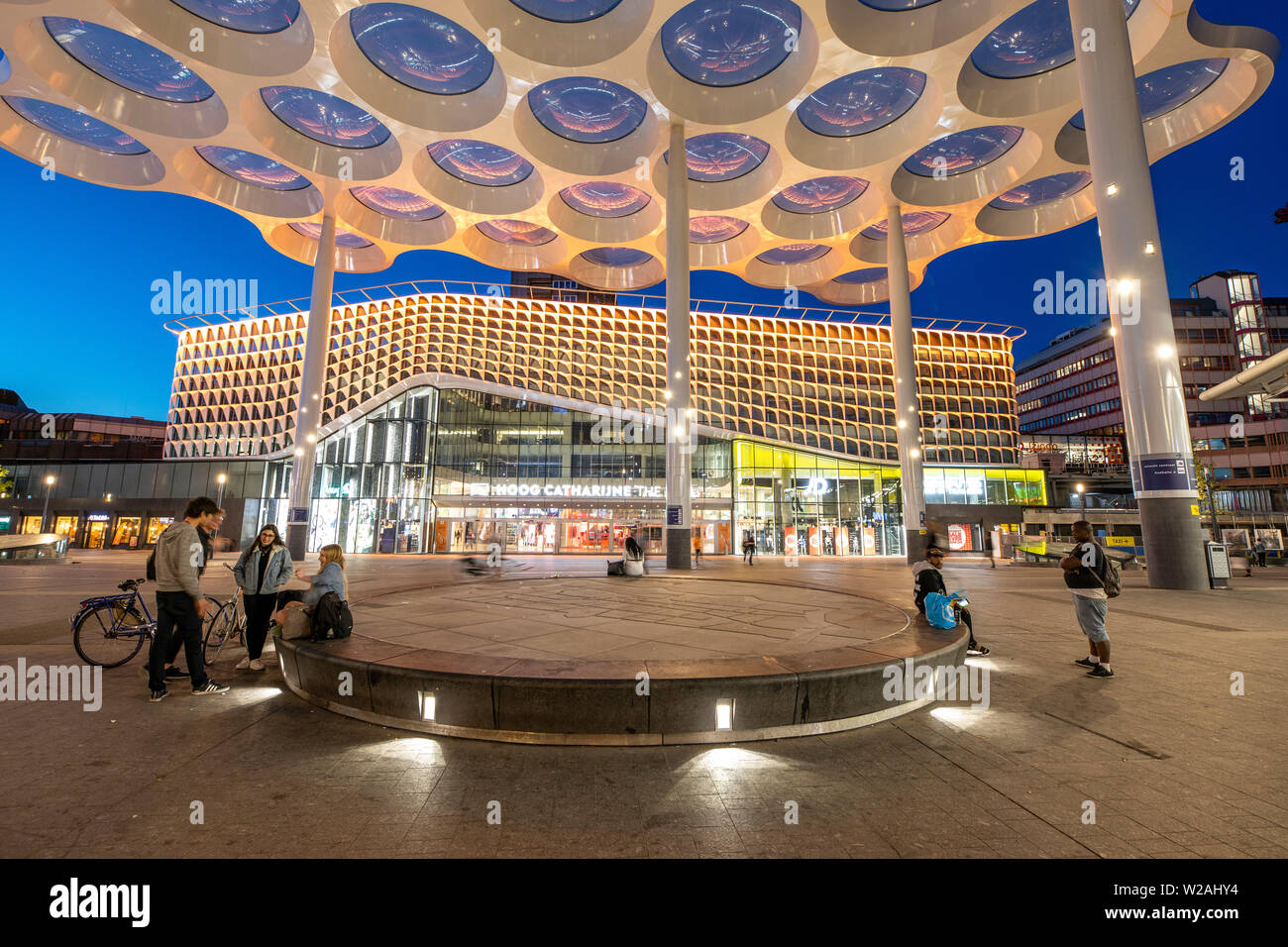 Utrecht, the Netherlands, station forecourt, Stationsplein, with a distinctive honeycomb canopy at Utrecht Centraal, Central Station, and the Hoog Cat Stock Photo