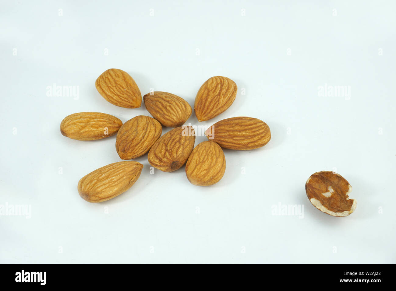 good and bad almonds isolated on white background Stock Photo Alamy