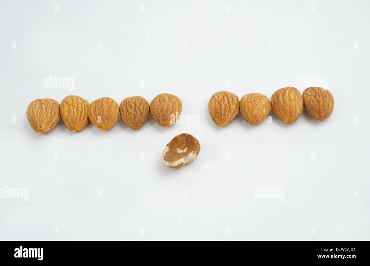 good and bad almonds isolated on white background Stock Photo Alamy
