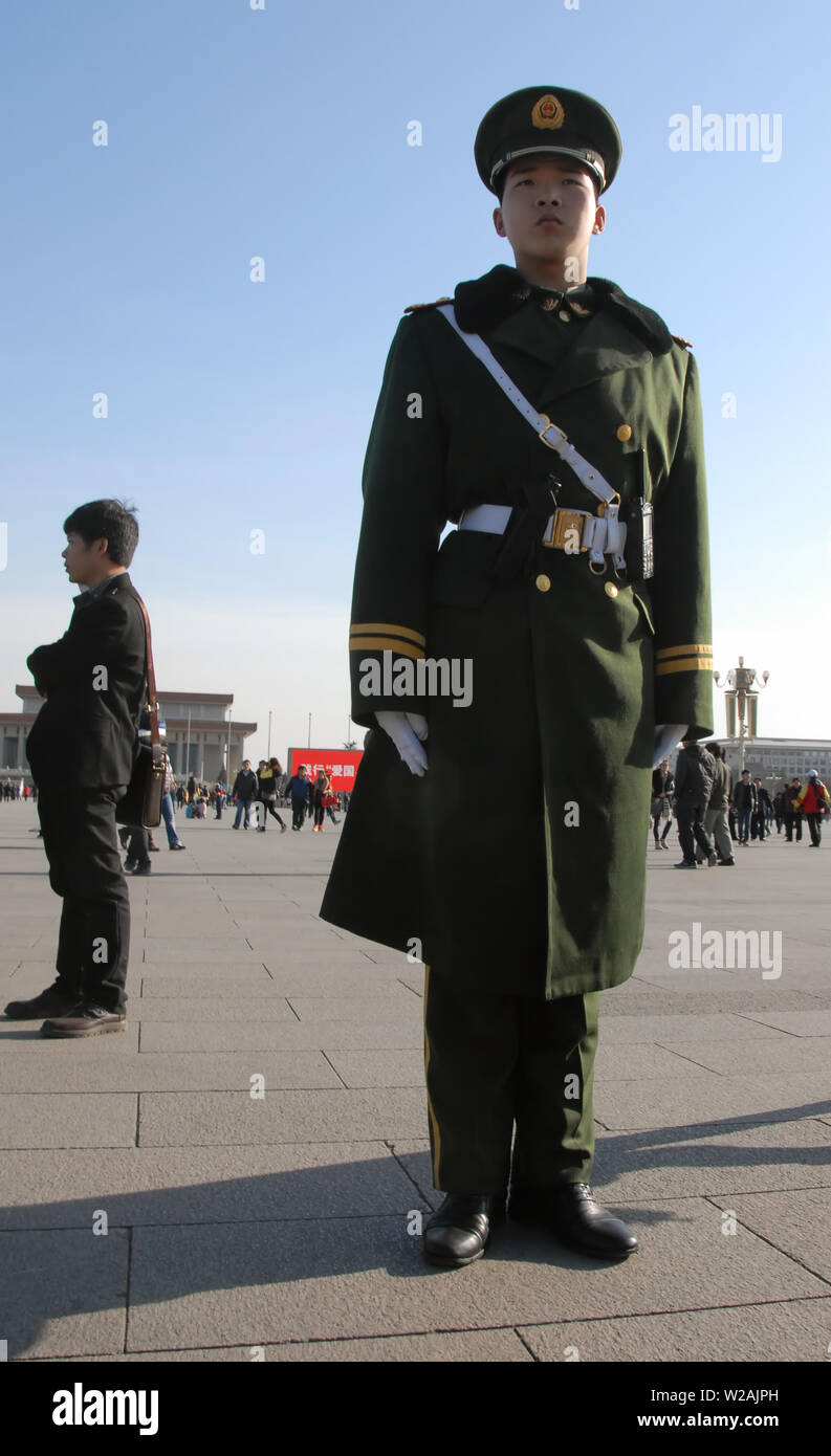 Chinese guard in Tiananmen Square, Beijing. Tiananmen Square is a famous landmark in Beijing. Chinese soldier in Tiananmen Square, Beijing, China. Stock Photo