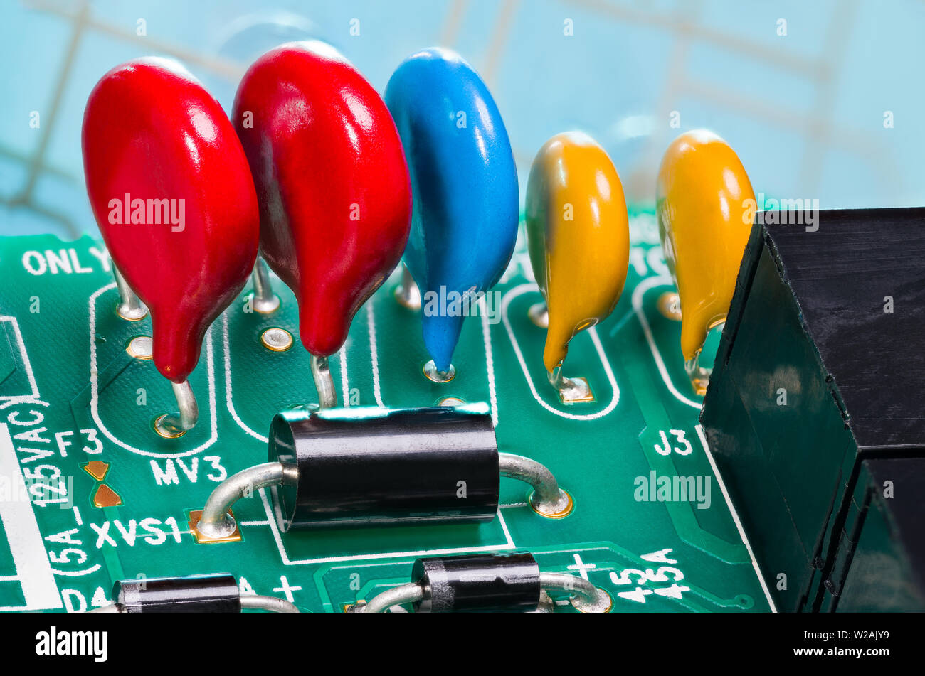 Colorful varistors. Circuit board detail. Electronic components for