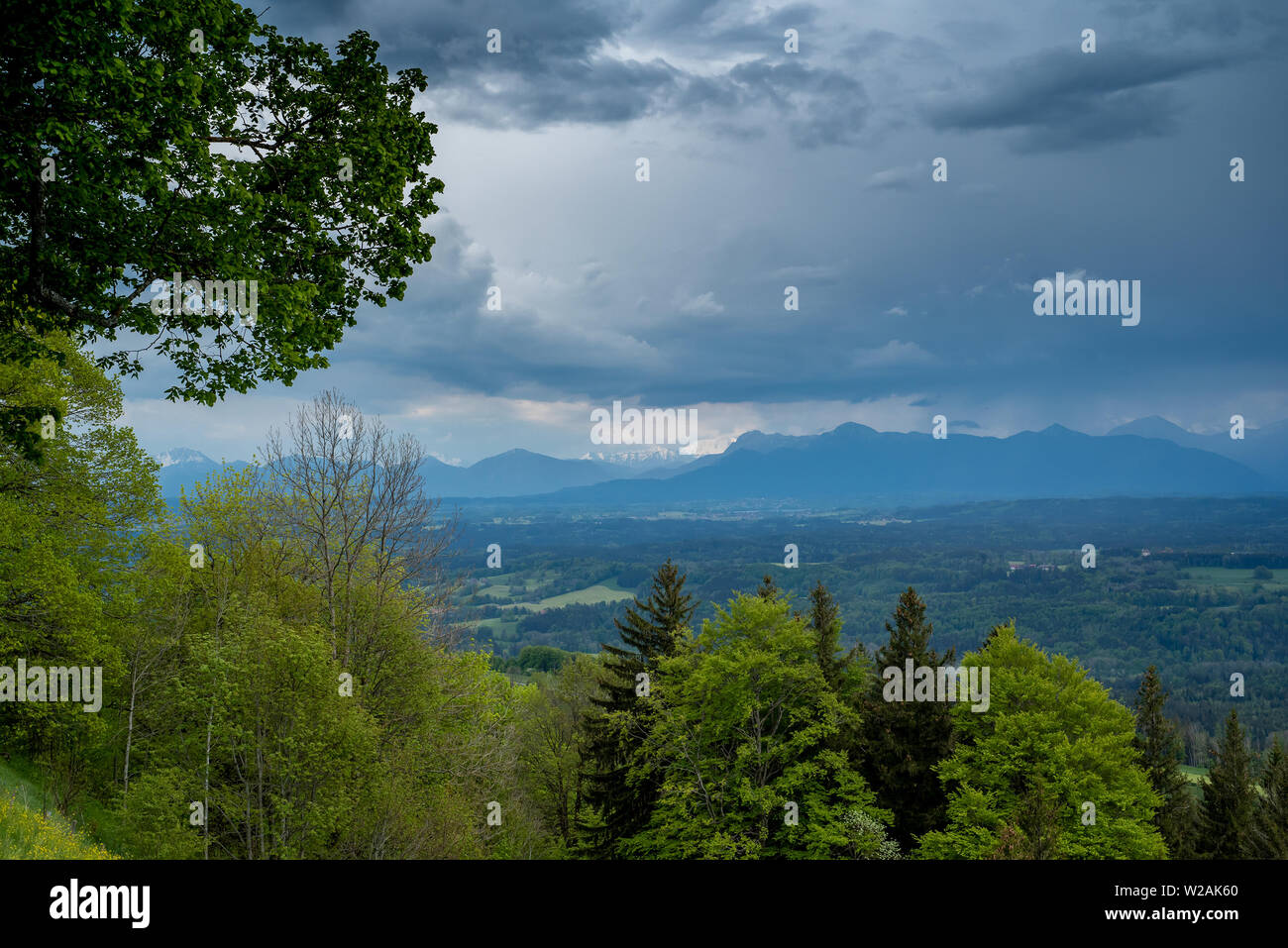 View of the Alps in the background in the spring during the day, from Hoher Peissenberg Stock Photo