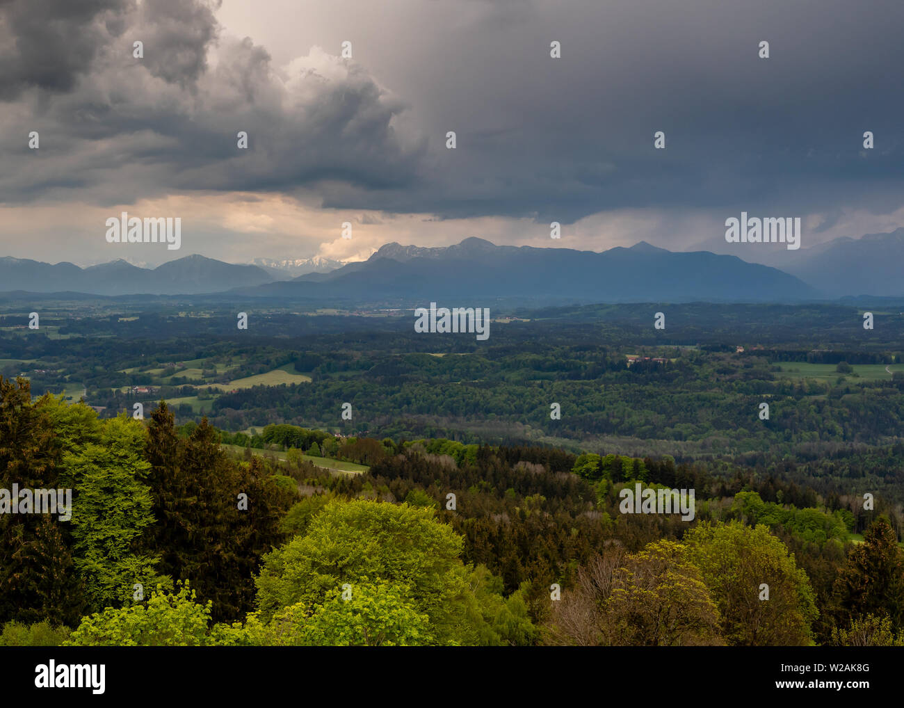 View of the Alps in the background in the spring during the day, from Hoher Peissenberg Stock Photo