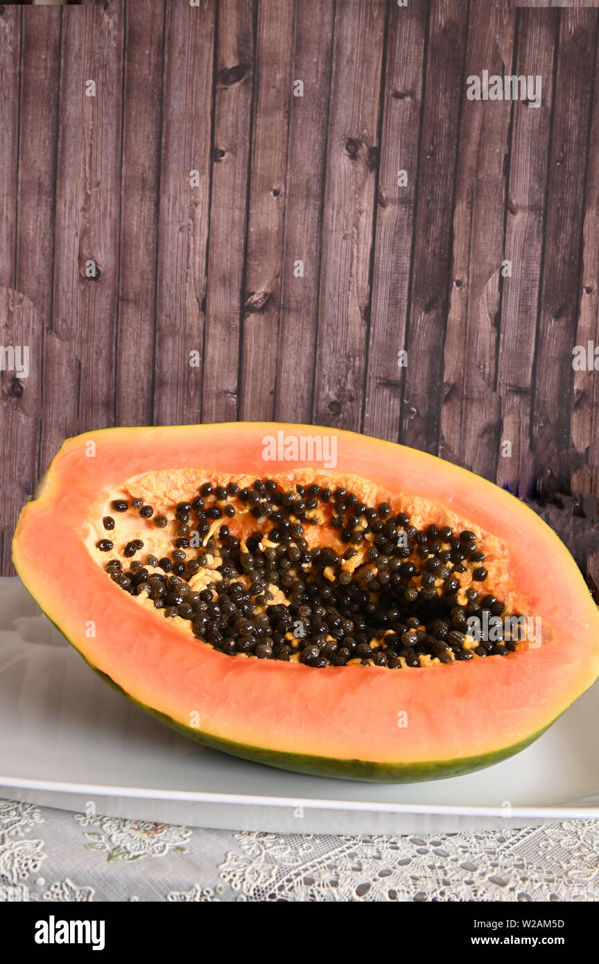 Cut Papaya with seeds in white dish Stock Photo Alamy
