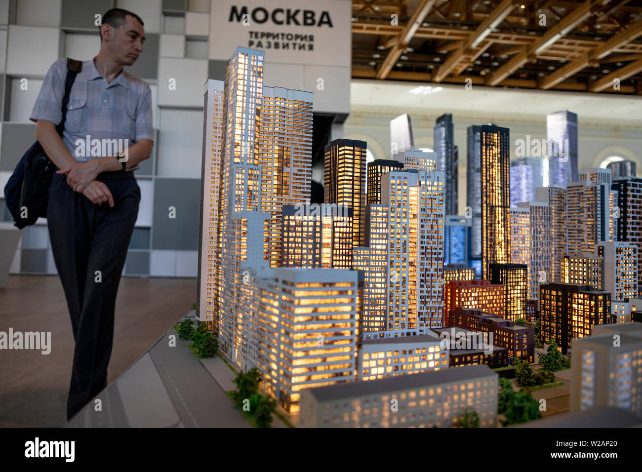 Moscow, Russia. 7th July, 2019: Visitors to the exhibition 'Moscow. The city is changing for you' in during of Moscow Urban Forum 2019 in the exhibition hall 'Manege' in central Moscow, Russia Stock Photo
