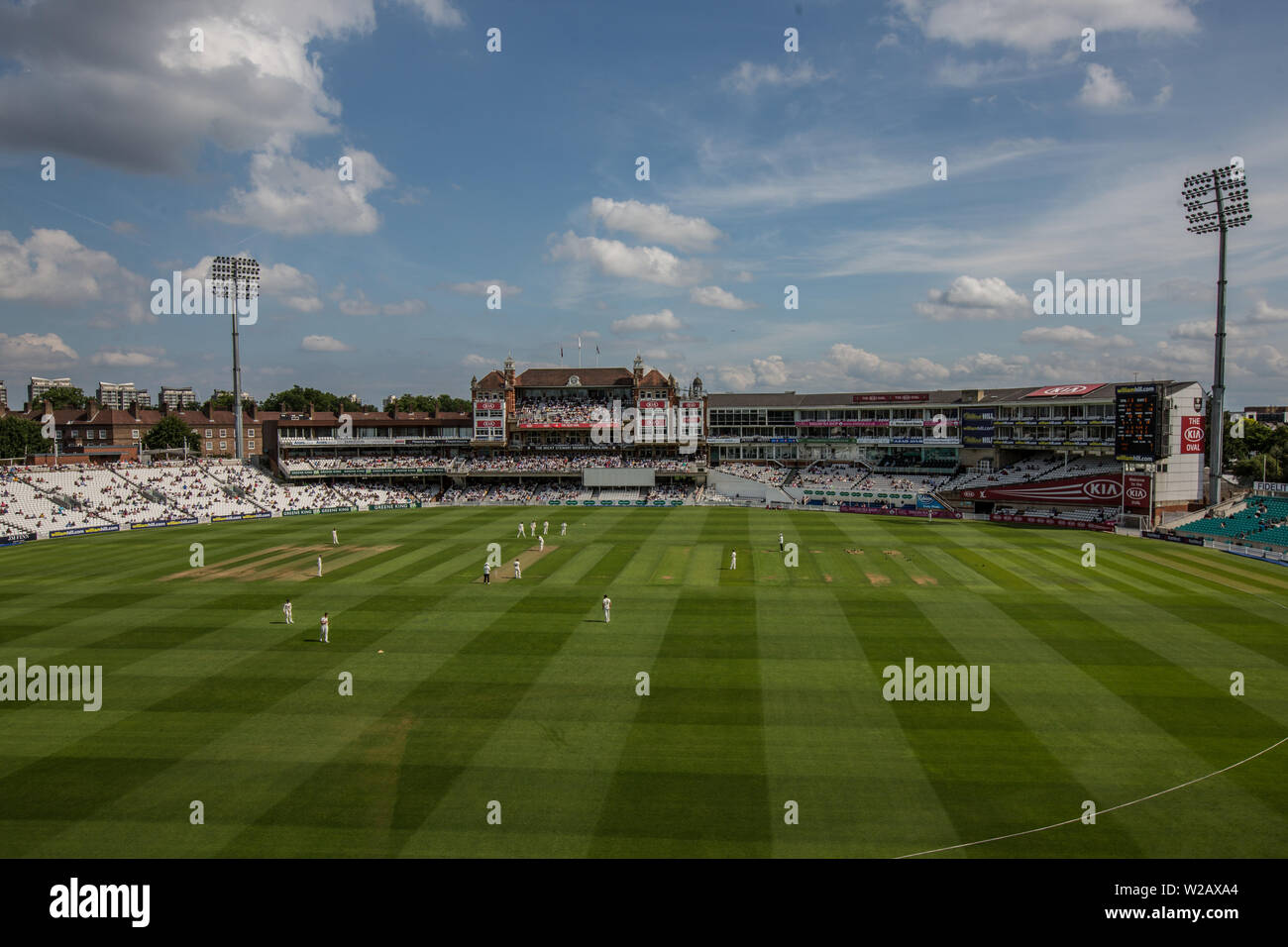 London, UK. 7 July, 2019.  Kent in the field  with the Micky Stewart Members' Pavilion in the background on the first day of the Specsavers County Championship game between Surrey and Kent at the Kia Oval. David Rowe/Alamy Live News Stock Photo