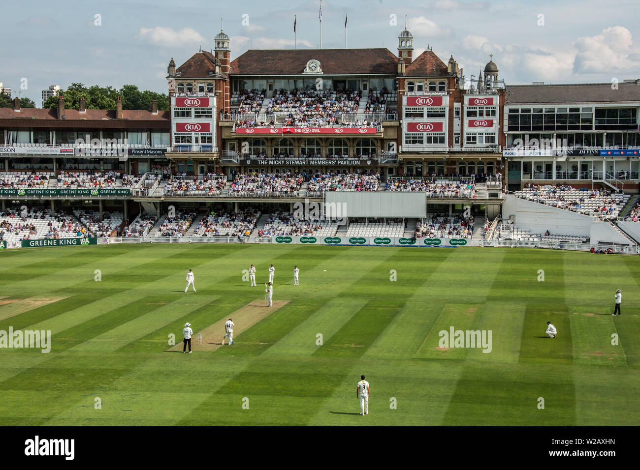 London, UK. 7 July, 2019.  Kent in the field  with the Micky Stewart Members' Pavilion in the background on the first day of the Specsavers County Championship game between Surrey and Kent at the Kia Oval. David Rowe/Alamy Live News Stock Photo