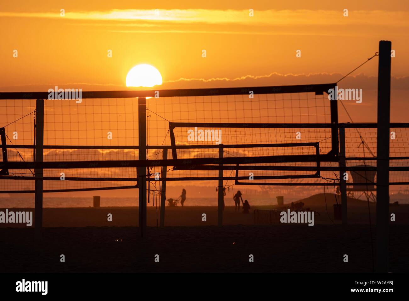Sunset at the beach with volleyball nets Stock Photo Alamy